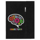 A black notebook cover features a stylized brain made of colorful gears. The word BRAINSTORM is written below in colorful block letters.