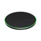 A sleek black wireless charging pad with a thin, illuminated green and blue rim. The circular device has a minimalist design, suitable for charging compatible electronic gadgets.