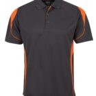 A short-sleeved polo shirt with a charcoal body and orange accents on the shoulders and sides. It features a three-button placket and a collar, designed for casual or sportswear.