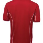 A red polo shirt with white piping along the seams is displayed from the back. It features short sleeves and a classic collar. The fabric appears smooth and lightweight.
