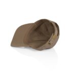 A Davie Six Panel Cap rests on a white surface, showcasing its curved brim, stitched panels, and the inside of the cap visible. At the back, it features a brass adjustable buckle strap.
