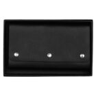 A black leather wallet with three metallic button snaps placed inside a rectangular black box, viewed from above.