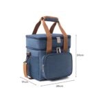 A blue insulated lunch bag with dual compartments and brown adjustable straps is shown. It has dimensions of 26cm in length, 17cm in width, and 24cm in height, featuring zippers and a front pocket.
