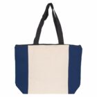 A canvas tote bag with a cream center panel and dark blue side panels. It features black handles and has a zippered top. The bag is set against a plain white background.