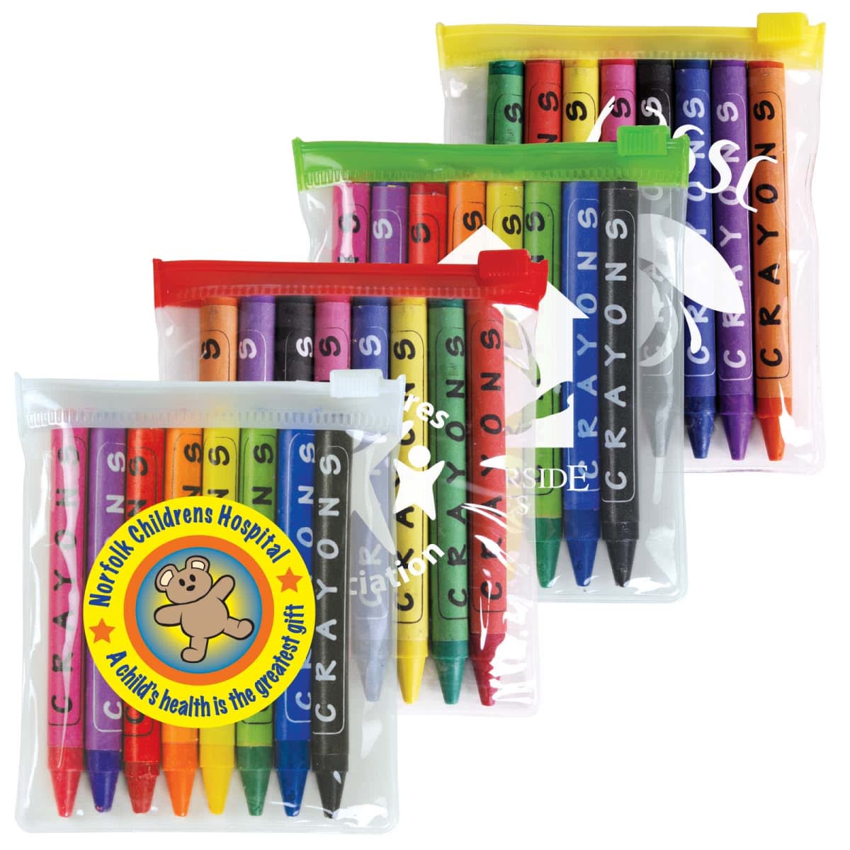 Four transparent zippered pouches, each containing a set of colorful crayons. The pouches have different colored zippers: yellow, green, red, and white. One pouch features a circular logo with a teddy bear and text supporting a childrens hospital.