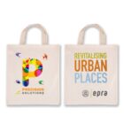 Two tote bags with handles. The left bag features a colorful P and the text PRECISION SOLUTIONS. The right bag reads REVITALISING URBAN PLACES with logos beneath, including epra.