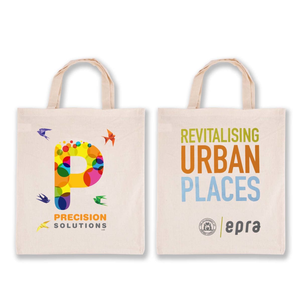 Two tote bags with handles. The left bag features a colorful P and the text PRECISION SOLUTIONS. The right bag reads REVITALISING URBAN PLACES with logos beneath, including epra.
