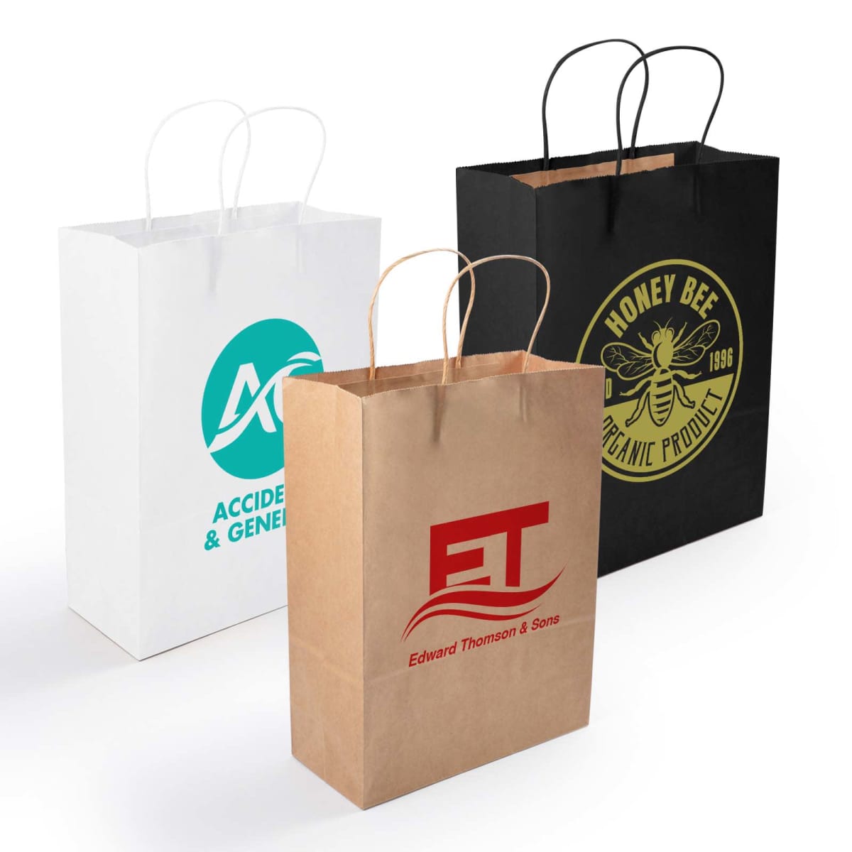 Three paper shopping bags are shown: a white one with AC and Accident & General, a brown one with ET and Edward Thomson & Sons, and a black one with a honey bee logo and Honey Bee Organic Product 1986. Each has string handles.