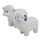 Two white sheep figurines on a plain background. The sheep in front has blue horns and a red smile, while the one behind has simpler features with no horns. Both have black eyes and small ears.