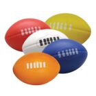 Five colorful rugby balls are grouped together. The balls are red, white, yellow, orange, and blue, each featuring a stylized pattern resembling stitches along their surfaces.