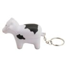 A keychain featuring a small, white cow figurine with black spots. The cow has a cute, rounded shape, and the keyring is attached to its tail via a short chain.