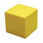 A bright yellow foam cube with smooth surfaces, positioned at an angle, casting a slight shadow on a white background.