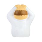 A ceramic figurine of a person wearing a white outfit, holding their hands on their head. The figure has short brown hair and a simplistic, faceless design.