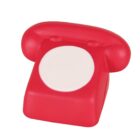 A red, vintage-style toy telephone with a rounded receiver and a blank white circular dial in the center.