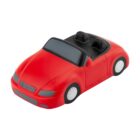 Toy model of a red convertible car with a black interior, viewed from a slightly elevated angle. The car has a stylized, cartoonish design with smooth, rounded edges and white wheels on a plain white background.