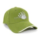 A green baseball cap with a paw print design and Concordia University of Edmonton text in white. The cap has a curved brim with a white accent along the edge.