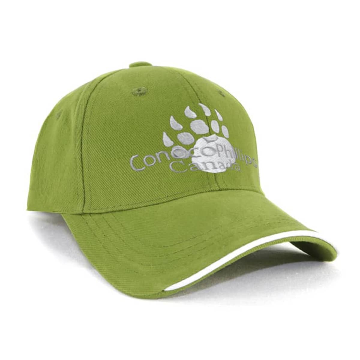 A green baseball cap with a paw print design and Concordia University of Edmonton text in white. The cap has a curved brim with a white accent along the edge.