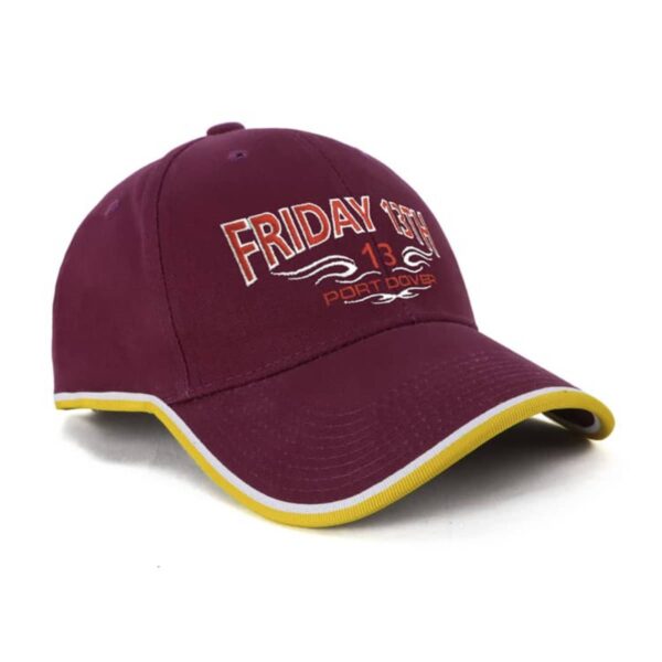 A maroon baseball cap with yellow trim on the brim, featuring the text Friday 13th and Port Dover in white and yellow embroidery on the front. The number 13 is prominently displayed below the text.