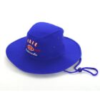 A vibrant blue wide-brimmed hat featuring the words Vail USA Colorado embroidered on the front in red and white. The hat has a chin strap with an adjustable toggle.