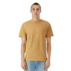 Adult in American Apparel beige T-shirt and blue jeans, against a white background.
