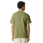 Adult in a green polycotton T-shirt and white pants, facing backward.