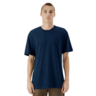 Person in an American Apparel Adult Relaxed Fit Jersey T-shirt against a white backdrop.