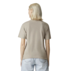 Person in a beige American Apparel Ladies’ Fine Jersey T-Shirt and light jeans, back view.