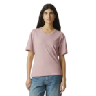 Person in an American Apparel Ladies’ Fine Jersey pink T-shirt and blue jeans on a white backdrop.