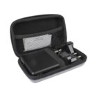 A black portable charger and plug with European pins are neatly packed inside a black zippered carrying case. The case has a mesh pocket and a strap securing the charger and plug in place.