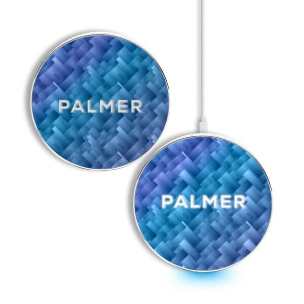 Two round wireless chargers with a blue geometric pattern and the word PALMER in white text. One charger is positioned vertically with a visible cord, and the other is slightly overlapping diagonally.