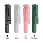 Four foldable electronic devices are displayed in a row, each in different colors: black, white, pink, and dark green. They have a sleek, cylindrical design with buttons on the side.