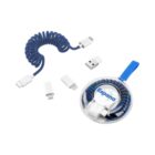A coiled USB-C cable in navy blue with detachable adapters for micro USB and lightning connections. The set includes a compact, round carrying case labeled Espana with a blue strap, and the adapters are displayed alongside.