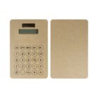 A minimalist, eco-friendly cardboard calculator with a digital display and round buttons is shown. Next to it, a matching piece of cardboard is placed, highlighting its simple and sustainable design.