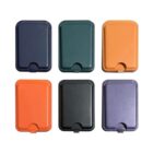 A collection of six rectangular leather cardholders in two rows, featuring colors: navy, dark green, orange, bright orange, black, and purple. Each cardholder has a semi-circular indent at the bottom.