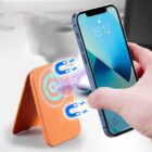 A person uses a smartphone to connect wirelessly to an orange magnetic charging device. The connection is illustrated with blue magnetic symbols and light effects. The phone shows the time as 18:12.