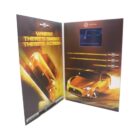 A promotional display for the Toyota 86 featuring a digitally rendered image of the car on both panels. The left panel shows the car in motion amidst flames. The right panel includes text options and a small screen at the top.