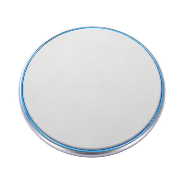 A round, flat white wireless charging pad with a metallic rim and a blue LED indicator. The surface appears smooth, designed for charging smartphones and compatible devices.