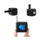 Small black portable speaker with glowing blue logo, shown from three different angles.