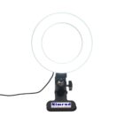 A circular ring light with a stand displaying the brand name Nimrud on its base. The light is illuminated and has a power cord attached.