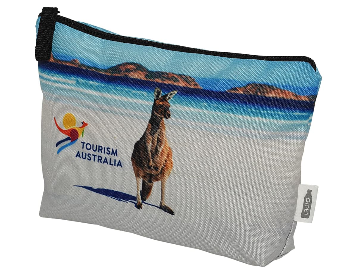 A pouch with an image of a kangaroo on a beach and the Tourism Australia logo. The background shows blue ocean waves and a sandy shoreline, with a zipper closure at the top.