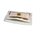 A transparent pouch houses the Customised Stationery Set, containing wooden rolling pins and a rectangular card with red stars and a circular emblem. The pouch is partially open, displaying the items inside.