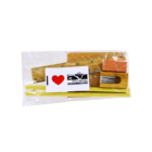 A clear plastic bag holds the Customised Stationery Set with a wooden ruler, sharpener, two yellow pencils, an orange eraser, and a card featuring a red heart and Alice Springs text.