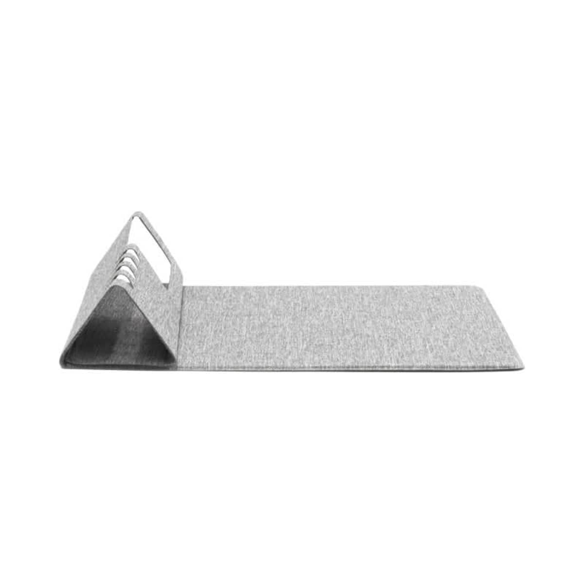 A gray, pyramid-shaped acoustic panel with multiple ridges sits against a flat gray mat, designed for sound absorption and minimalistic decor.