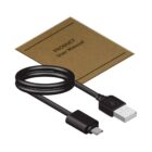 A coiled black USB cable with a micro USB connector on one end and a standard USB connector on the other, placed next to a brown product user manual.