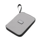 A gray rectangular zippered pouch with a black trim and a loop handle. A small black rectangular patch is visible on the front.