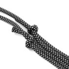Close-up of two black and white checkered ropes tied with knots, positioned parallel on a white background.
