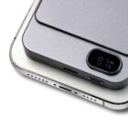 Close-up of a thin gray battery pack attached to the back of a smartphone. The battery pack display shows 97% indicating its charge level. The phones charging port is visible at the bottom.