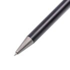 Close-up of a black pen pointing towards the bottom-left corner. The pen has a metallic tip and a sleek, matte finish. The focus is on the tip, highlighting its precision design.