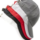 Five perforated caps stacked in gray, red, white, and black colors, side view.