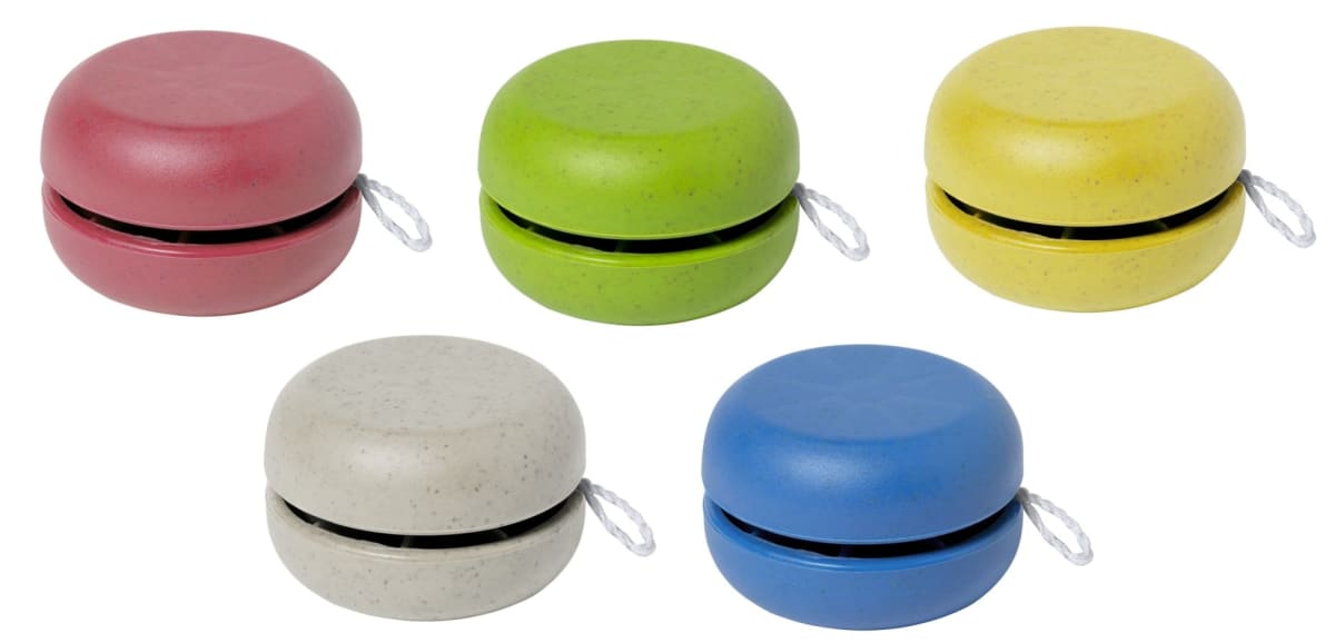 Five yo-yos in red, green, yellow, gray, and blue are arranged in a row. Each yo-yo has a white string attached.